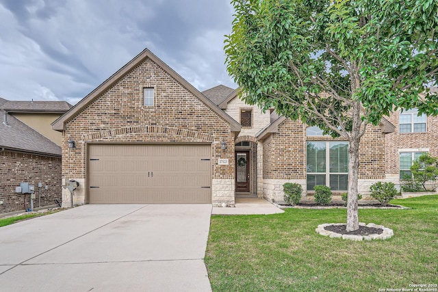 27123 Brook Bnd, Boerne, TX 78015 - view of front of house with brick siding, concrete driveway, a front lawn, a garage, and stone siding