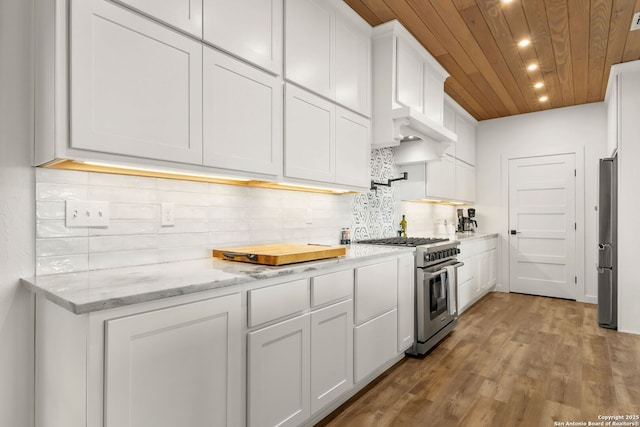 29720 Twin Creeks, Bulverde, TX 78163 - kitchen with appliances with stainless steel finishes, wooden ceiling, white cabinetry, wood finished floors, and decorative backsplash