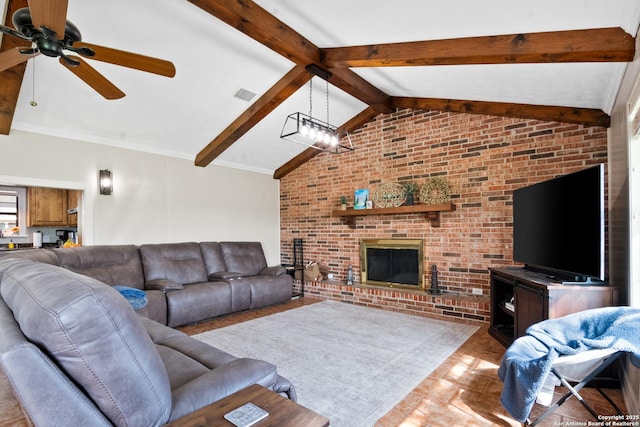 1373 County Road 373, Uvalde, TX 78801 - living area with ceiling fan, brick wall, and a brick fireplace
