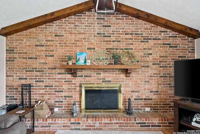 1373 County Road 373, Uvalde, TX 78801 - detailed view of beam ceiling, a brick fireplace, and brick wall