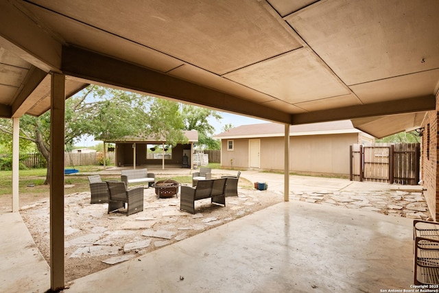 1373 County Road 373, Uvalde, TX 78801 - fenced backyard featuring an outdoor fire pit and a patio
