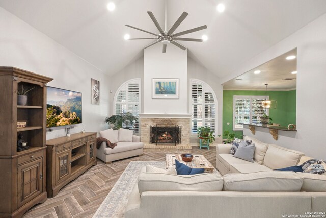 2326 Blackoak Bnd, San Antonio, TX 78248 - living room featuring a ceiling fan, recessed lighting, a warm lit fireplace, and high vaulted ceiling