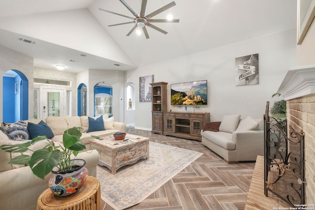 2326 Blackoak Bnd, San Antonio, TX 78248 - living area featuring arched walkways, a ceiling fan, high vaulted ceiling, and a brick fireplace