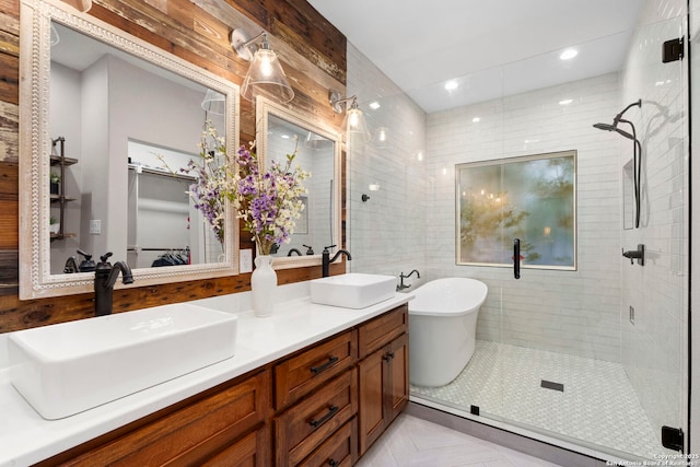 608 Kendall Pkwy, Boerne, TX 78015 - bathroom featuring a shower stall, double vanity, a freestanding tub, and tile patterned flooring