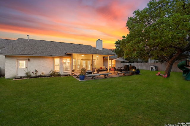 608 Kendall Pkwy, Boerne, TX 78015 - back of house featuring a patio, a chimney, a shingled roof, and brick siding
