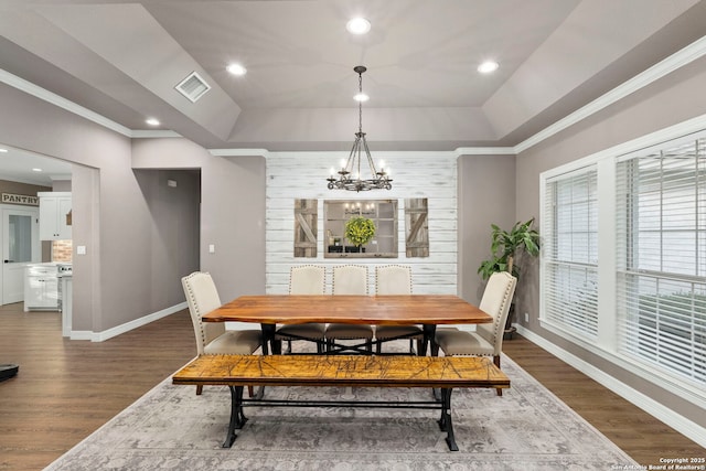 608 Kendall Pkwy, Boerne, TX 78015 - dining room featuring a chandelier, wood finished floors, a tray ceiling, ornamental molding, and recessed lighting