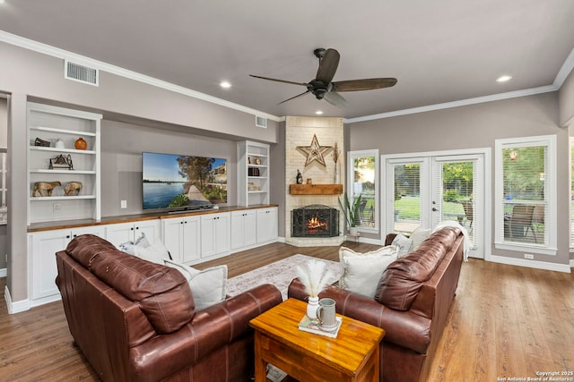 608 Kendall Pkwy, Boerne, TX 78015 - living room featuring a ceiling fan, ornamental molding, wood finished floors, recessed lighting, and french doors