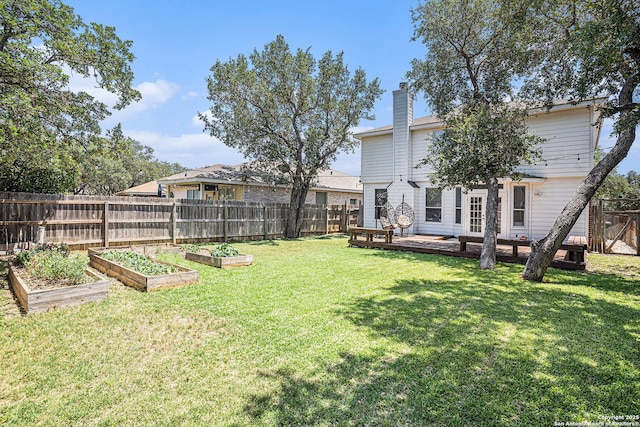 13812 Riverbank Pass, Helotes, TX 78023 - fenced backyard with a garden and a deck