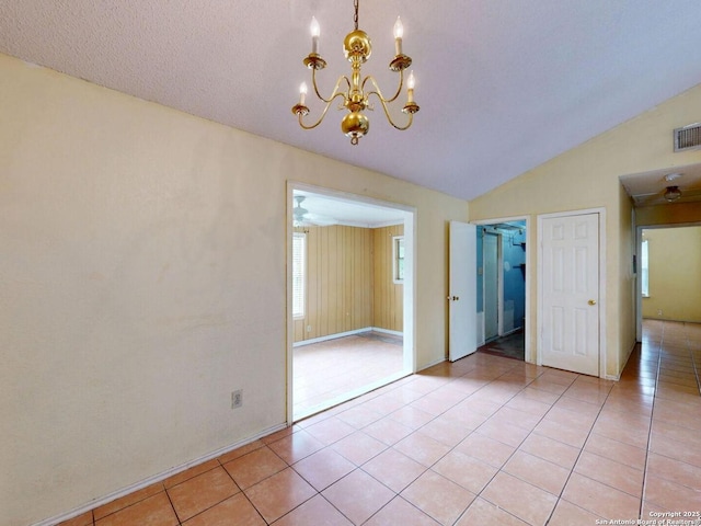 3415 Twining, San Antonio, TX 78211 - unfurnished dining area featuring a chandelier, light tile patterned floors, and lofted ceiling