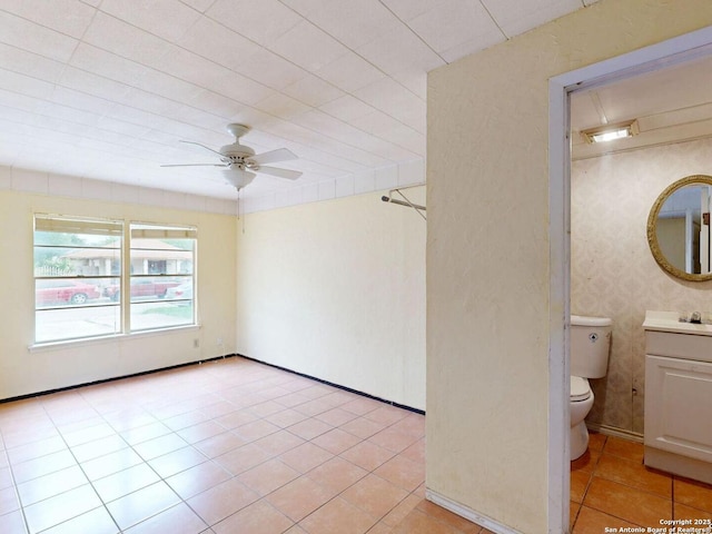 3415 Twining, San Antonio, TX 78211 - empty room with a ceiling fan and light tile patterned floors