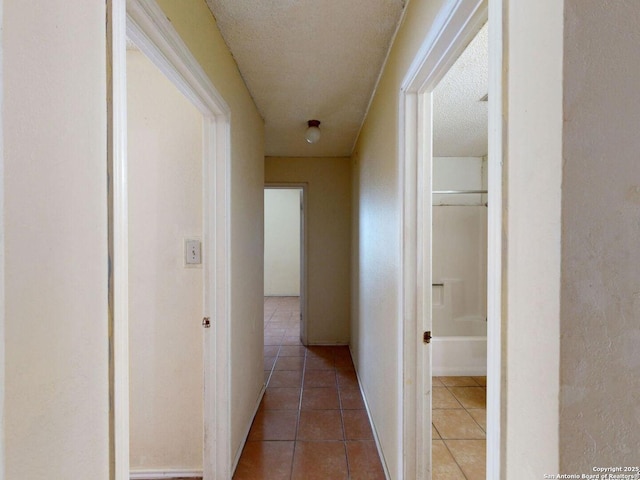 3415 Twining, San Antonio, TX 78211 - hallway with tile patterned floors and a textured ceiling