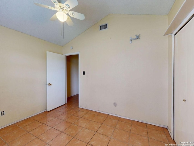 3415 Twining, San Antonio, TX 78211 - empty room with vaulted ceiling, ceiling fan, and light tile patterned floors