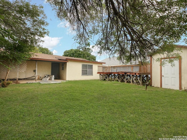 3415 Twining, San Antonio, TX 78211 - back of property featuring a lawn, a patio, and a storage shed
