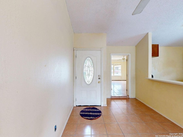 3415 Twining, San Antonio, TX 78211 - entryway featuring tile patterned floors, a textured ceiling, and ceiling fan