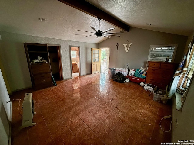 215 W Academy, San Antonio, TX 78226 - living room featuring a ceiling fan, a textured ceiling, and tile patterned floors