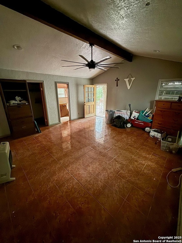 215 W Academy, San Antonio, TX 78226 - tiled living room featuring a textured ceiling and a ceiling fan