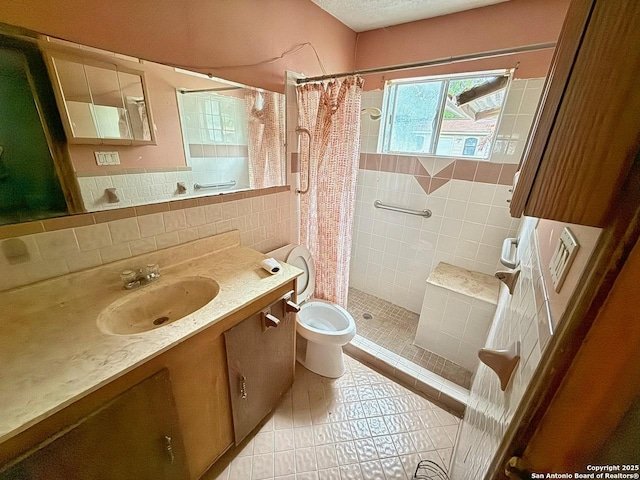 215 W Academy, San Antonio, TX 78226 - full bathroom with tile patterned flooring, tile walls, a stall shower, and vanity