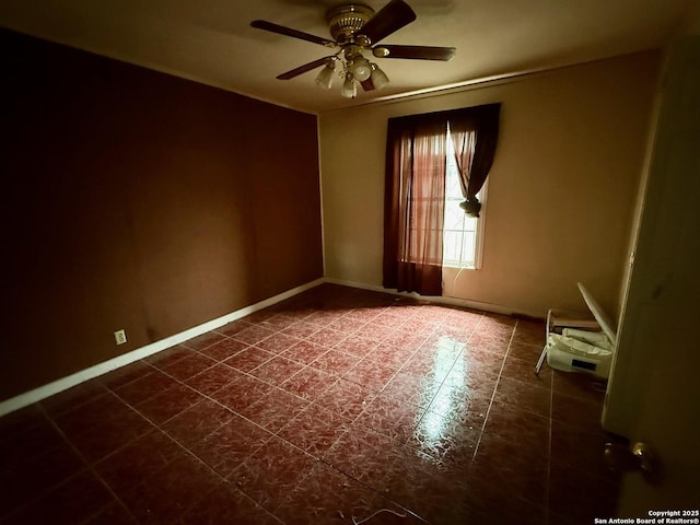 215 W Academy, San Antonio, TX 78226 - spare room featuring a ceiling fan and dark tile patterned floors