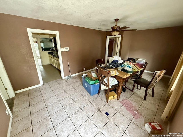 215 W Academy, San Antonio, TX 78226 - dining room with light tile patterned floors, a ceiling fan, and a textured ceiling