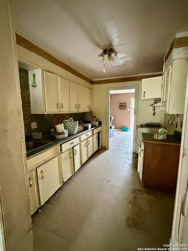 215 W Academy, San Antonio, TX 78226 - kitchen with dark countertops and white cabinets