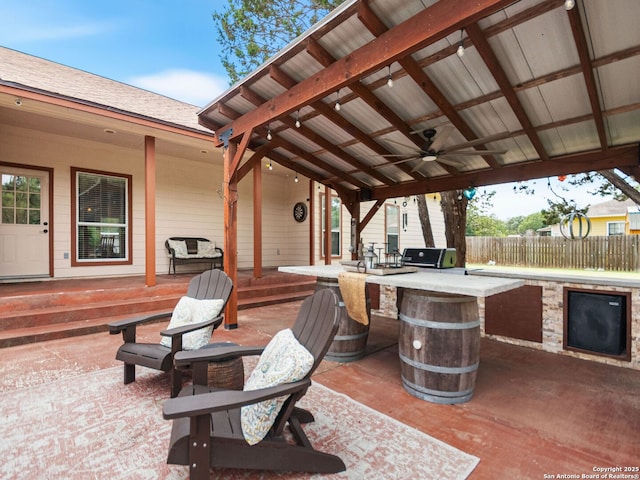 1131 Meadow Stream Rd, Spring Branch, TX 78070 - view of patio with a ceiling fan and an outdoor kitchen