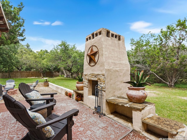 1131 Meadow Stream Rd, Spring Branch, TX 78070 - view of patio with an outdoor stone fireplace