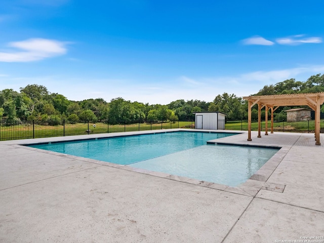 1131 Meadow Stream Rd, Spring Branch, TX 78070 - view of swimming pool with a pergola, a patio area, a storage unit, and view of wooded area