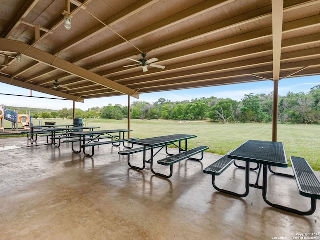 1131 Meadow Stream Rd, Spring Branch, TX 78070 - view of patio / terrace with ceiling fan, view of wooded area, grilling area, and outdoor dining space