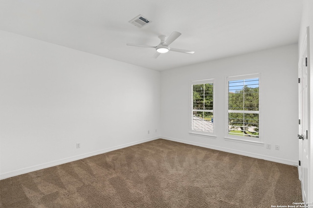 6 Champions Way, San Antonio, TX 78258 - empty room with dark colored carpet and a ceiling fan