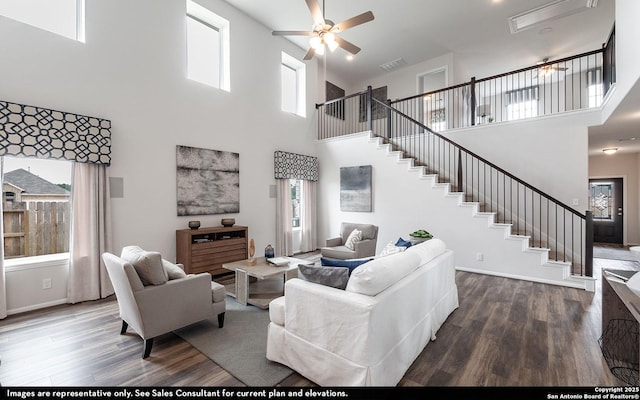 14704 Lower Holw, San Antonio, TX 78252 - living room featuring ceiling fan, a high ceiling, wood finished floors, and stairs