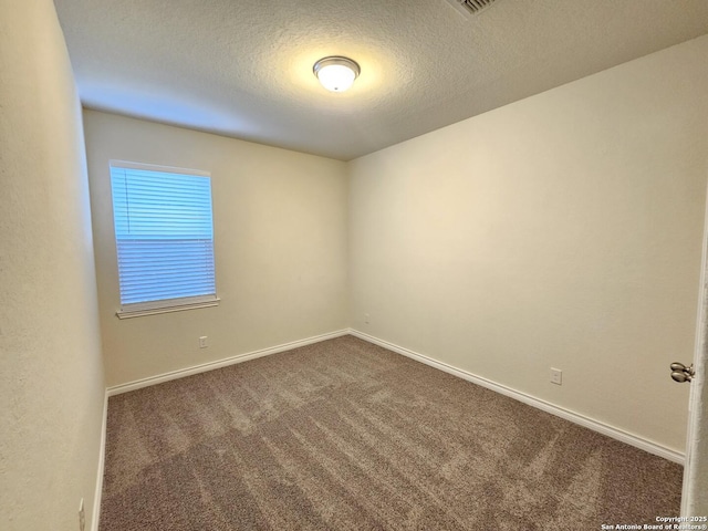 6723 Luckey Pond, San Antonio, TX 78252 - spare room featuring dark colored carpet and a textured ceiling