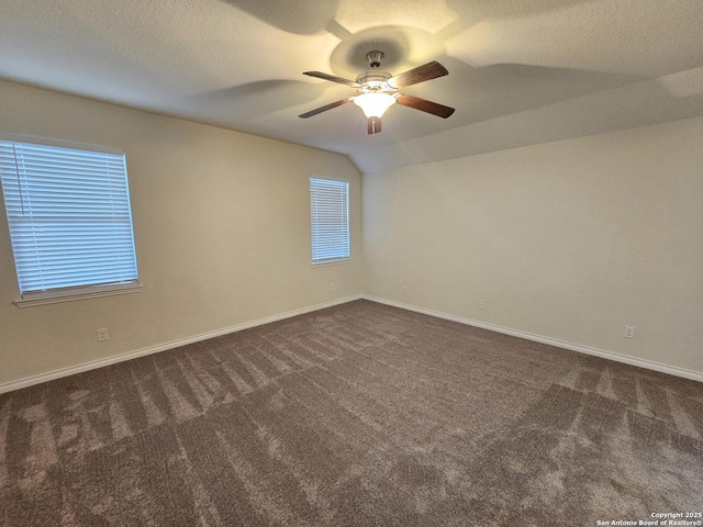 6723 Luckey Pond, San Antonio, TX 78252 - spare room with dark carpet, ceiling fan, and vaulted ceiling