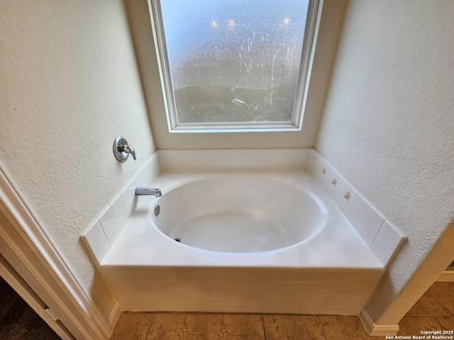 6723 Luckey Pond, San Antonio, TX 78252 - full bathroom with a textured wall, a garden tub, and tile patterned flooring