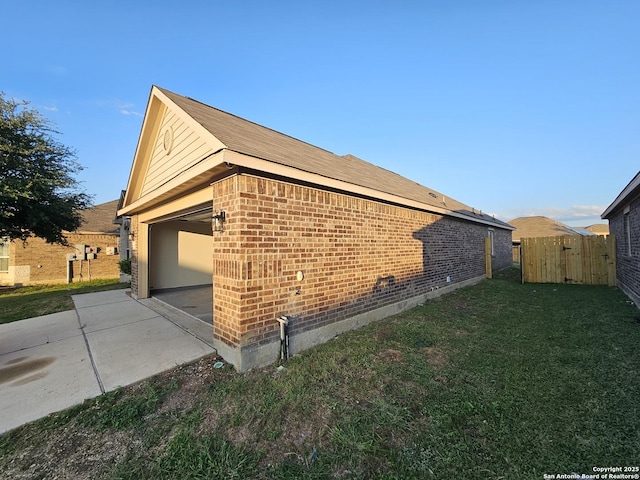 6723 Luckey Pond, San Antonio, TX 78252 - view of side of home featuring brick siding, a garage, and concrete driveway