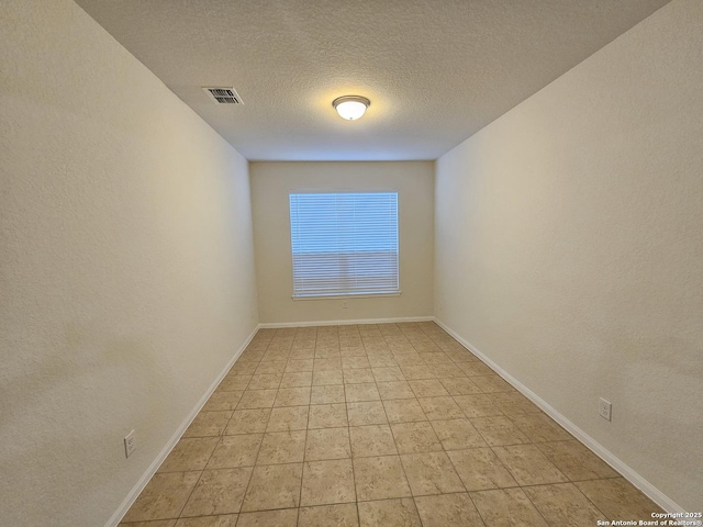 6723 Luckey Pond, San Antonio, TX 78252 - empty room with a textured ceiling and baseboards