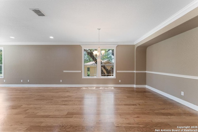 120 Red Bud, Boerne, TX 78006 - unfurnished room featuring crown molding, a chandelier, light wood-type flooring, and recessed lighting