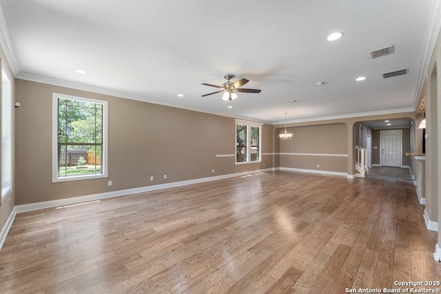 120 Red Bud, Boerne, TX 78006 - empty room with ornamental molding, ceiling fan, arched walkways, light wood-style flooring, and recessed lighting