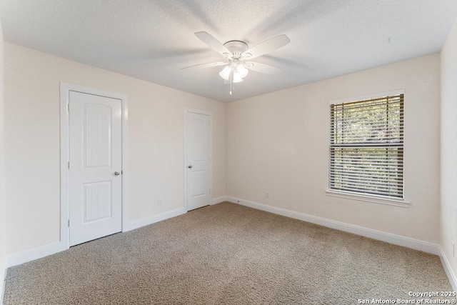 120 Red Bud, Boerne, TX 78006 - unfurnished bedroom with carpet floors, a ceiling fan, and a textured ceiling