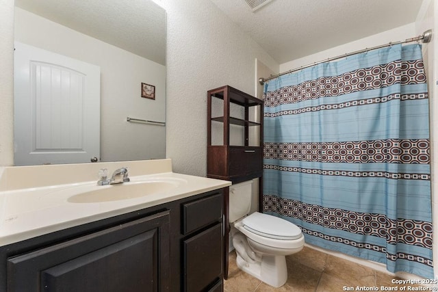 120 Red Bud, Boerne, TX 78006 - bathroom with vanity, a textured wall, tile patterned flooring, a shower with shower curtain, and a textured ceiling