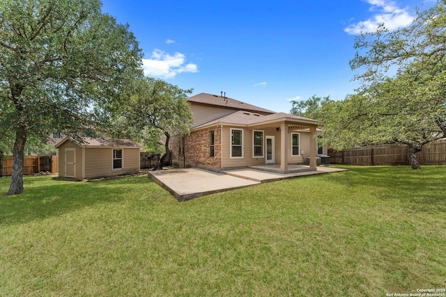 120 Red Bud, Boerne, TX 78006 - rear view of house featuring a fenced backyard, a patio, and a storage unit