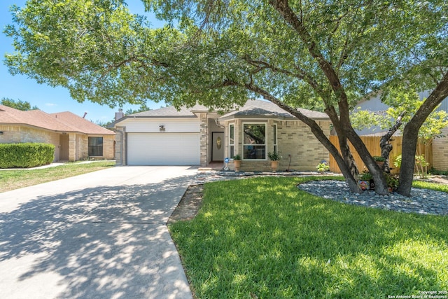10707 Lake Path, San Antonio, TX 78217 - view of front facade with an attached garage, concrete driveway, and brick siding