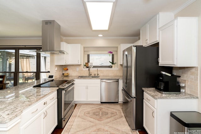 10707 Lake Path, San Antonio, TX 78217 - kitchen featuring appliances with stainless steel finishes, island range hood, healthy amount of natural light, a peninsula, and crown molding