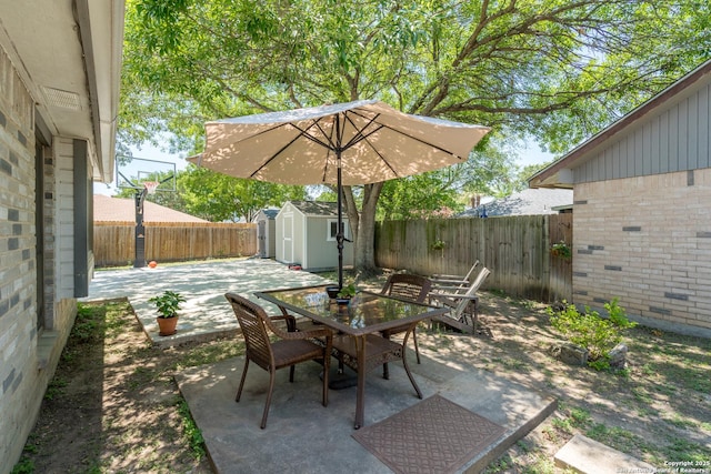 10707 Lake Path, San Antonio, TX 78217 - fenced backyard with outdoor dining area, a storage shed, and a patio area