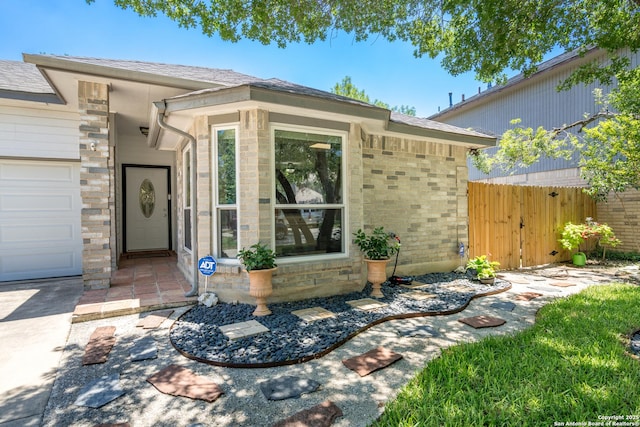 10707 Lake Path, San Antonio, TX 78217 - doorway to property with stone siding and a shingled roof