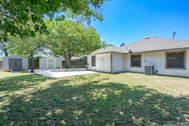 10707 Lake Path, San Antonio, TX 78217 - back of property with a storage unit and a patio area