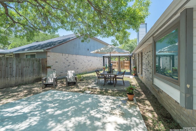 10707 Lake Path, San Antonio, TX 78217 - fenced backyard with a patio and outdoor dining area