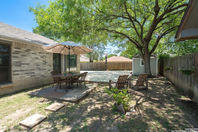 10707 Lake Path, San Antonio, TX 78217 - fenced backyard with a storage shed and a patio area