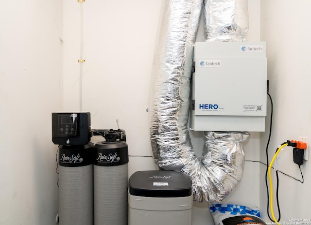 10707 Lake Path, San Antonio, TX 78217 - utility room featuring tankless water heater