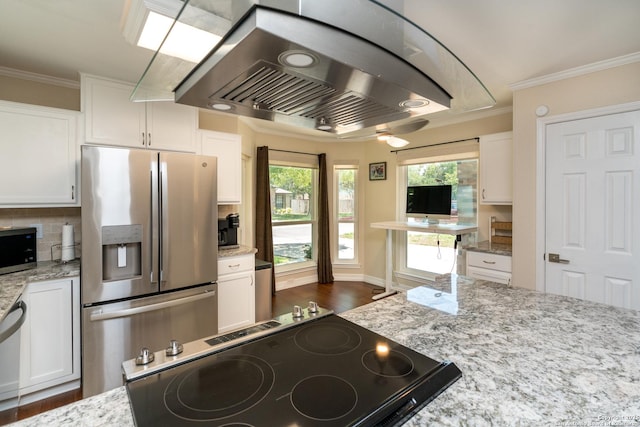 10707 Lake Path, San Antonio, TX 78217 - kitchen with appliances with stainless steel finishes, island range hood, white cabinets, light stone countertops, and crown molding