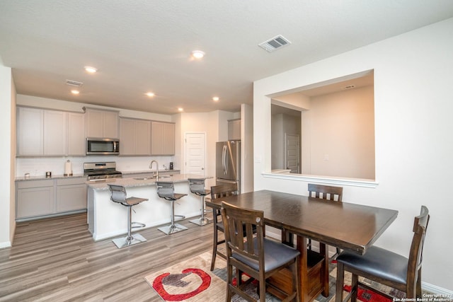 4951 Ranahan Pass, Saint Hedwig, TX 78152 - dining room featuring light wood-type flooring and recessed lighting